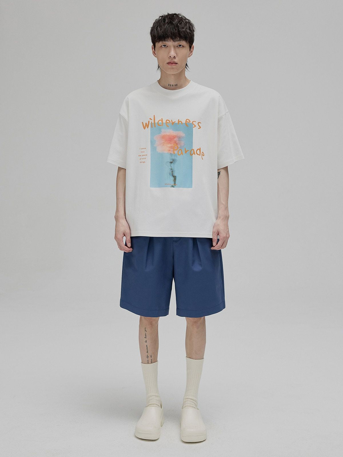 NANS Wilderness Parade Mercerized Tee in Orange - On Model