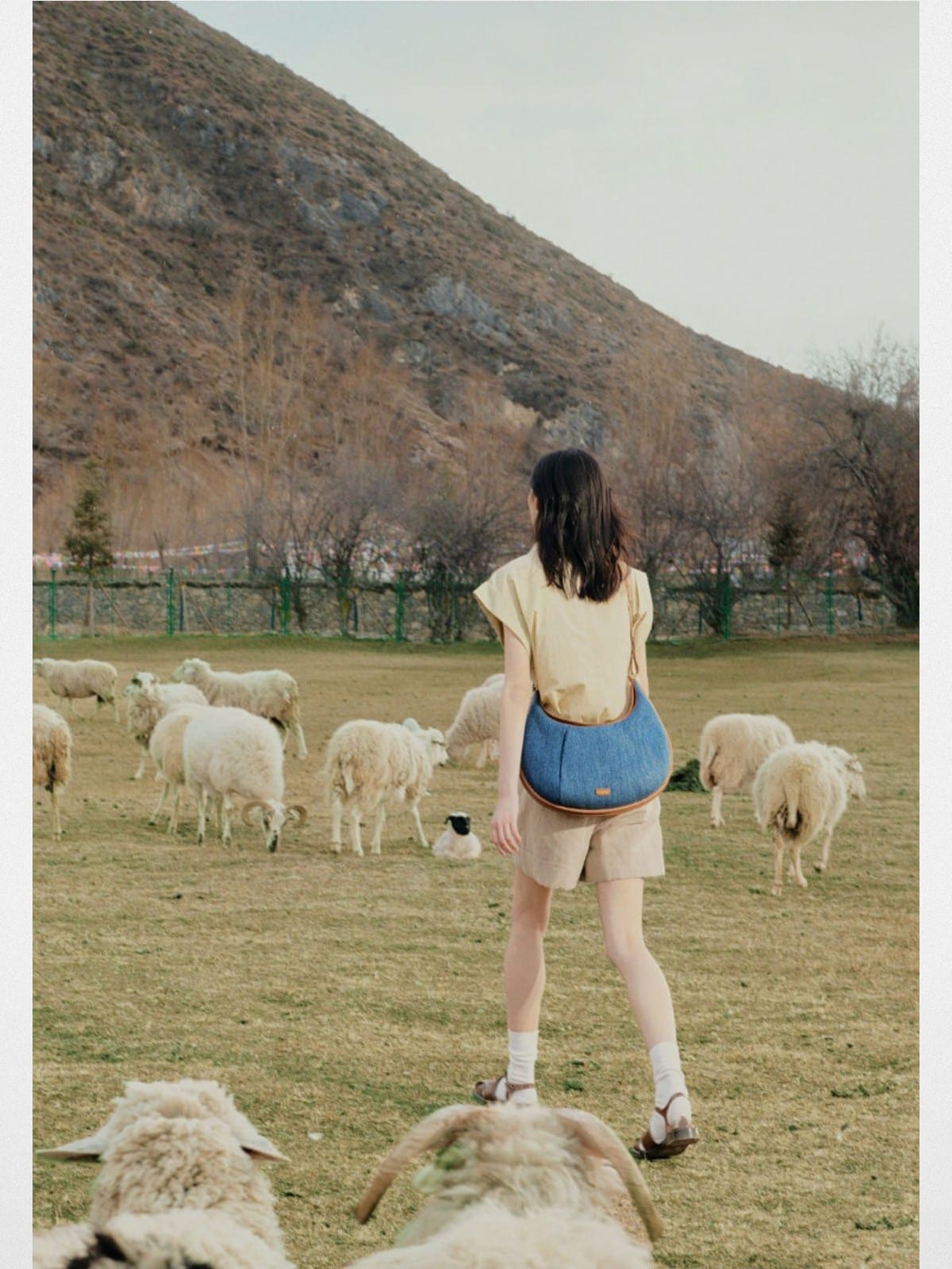 Songmont Denim Leather Crescent Bag in Blue - On Model