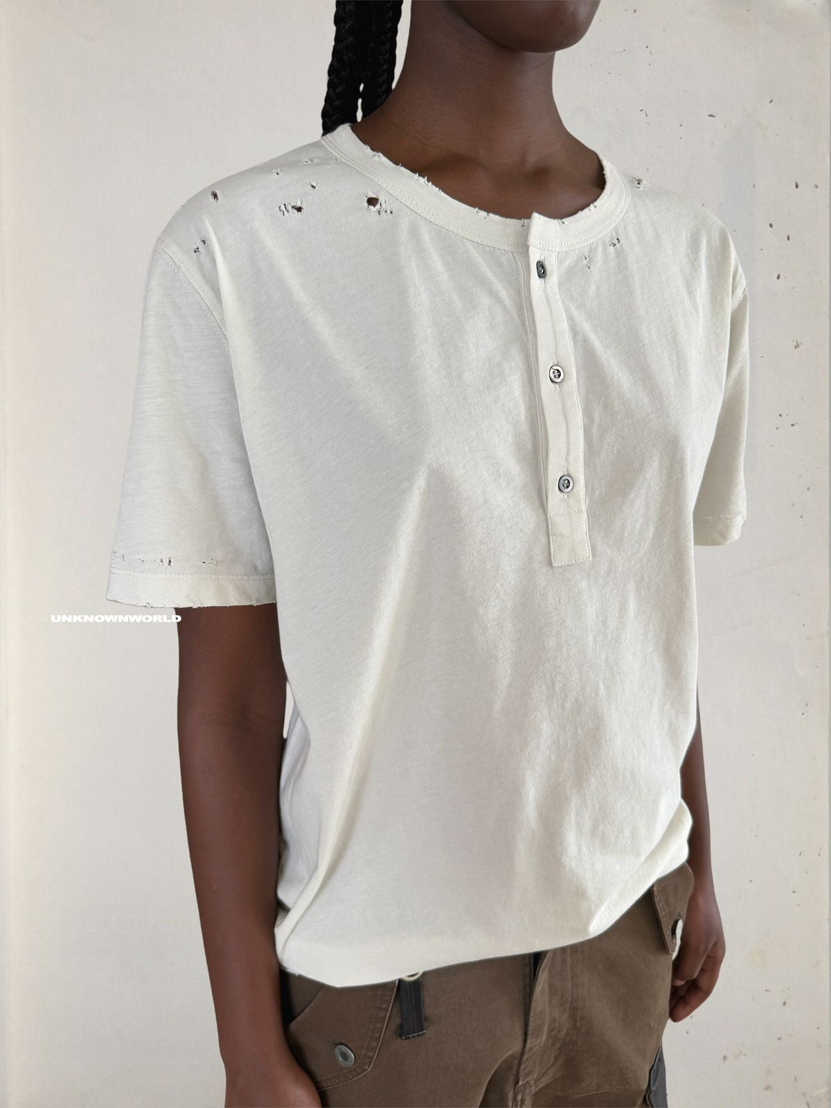 UNKNOWNWORLD Distressed Cotton Henley T Shirt in White - On Model