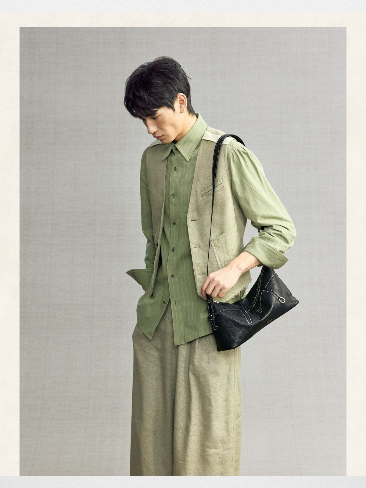 Songmont Vegetable Tanned Lambskin Pillow Hobo in Black - On Male Model