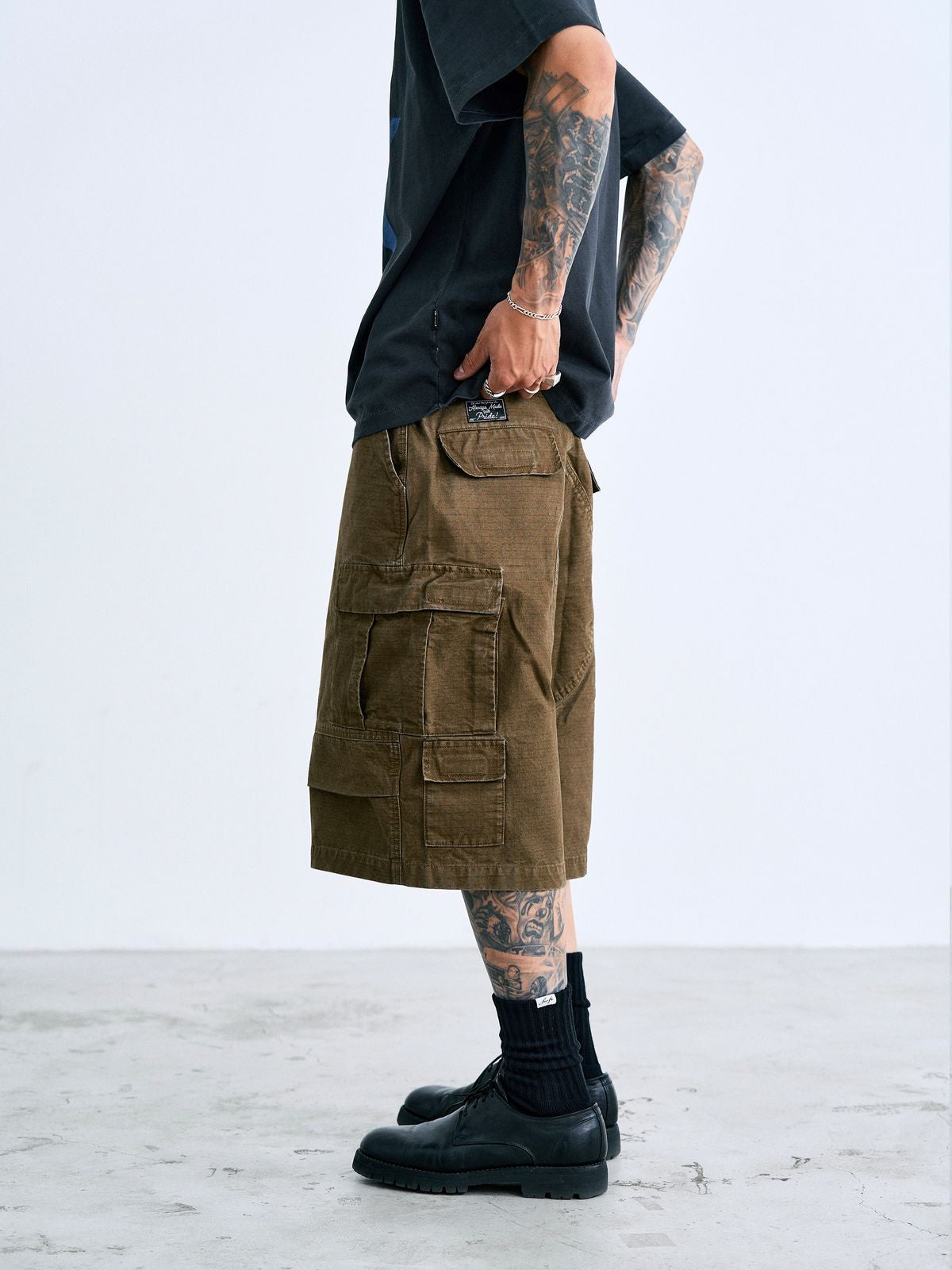 SWFI Distressed Wide Leg Cargo Shorts in Olive - On Model