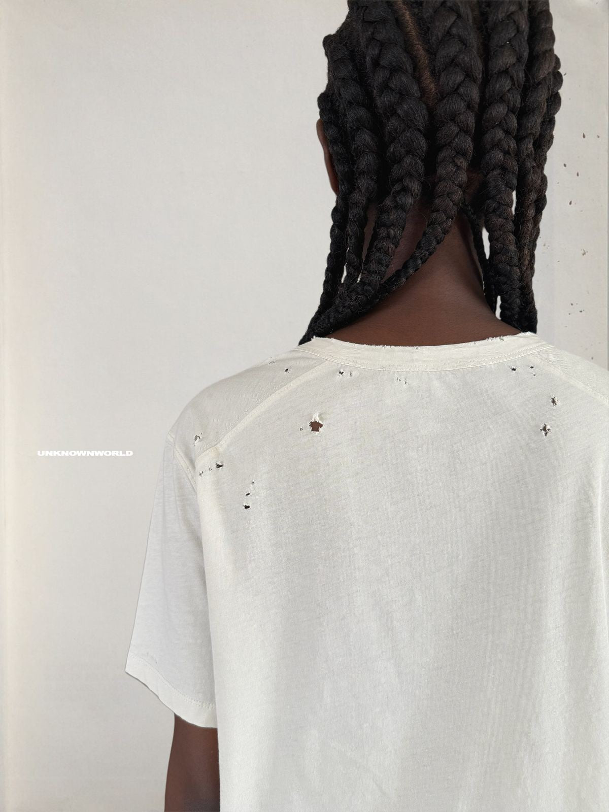 UNKNOWNWORLD Distressed Cotton Henley T Shirt in White - On Model