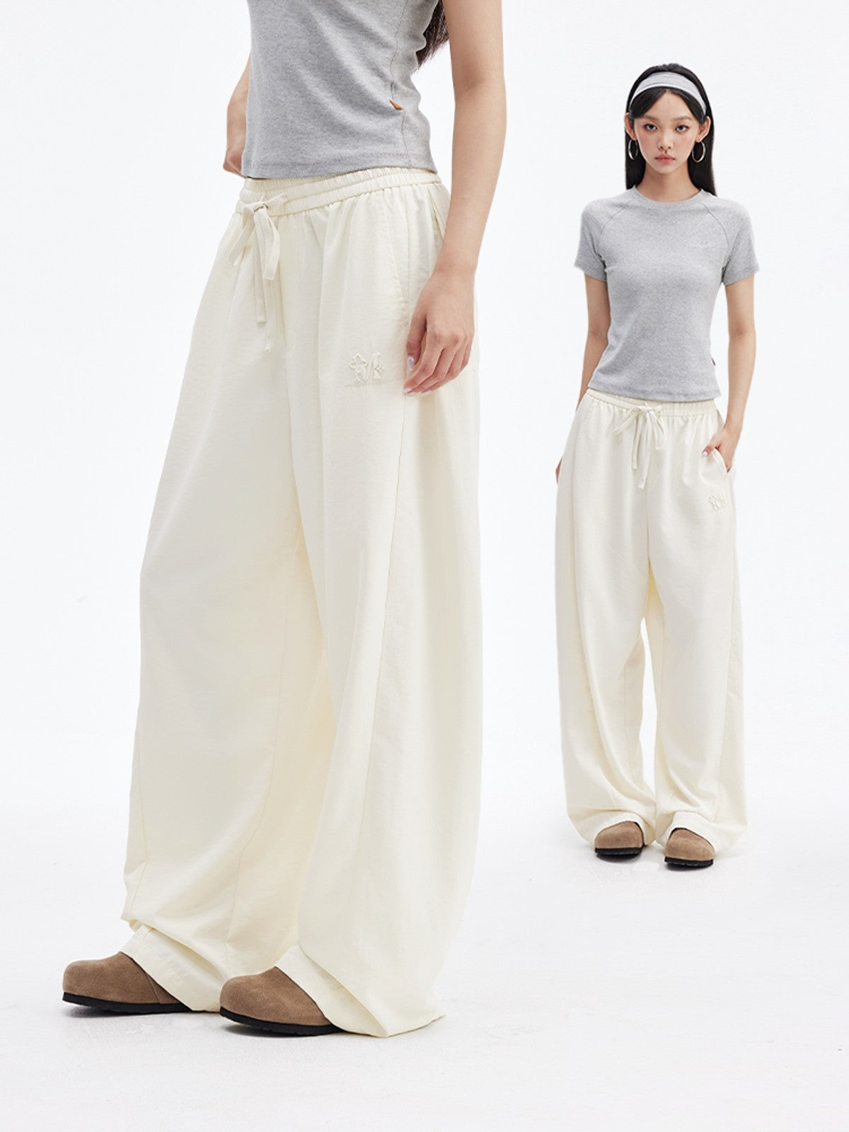 MEDM Cooling Wide Leg Track Pants in White - On Female Model