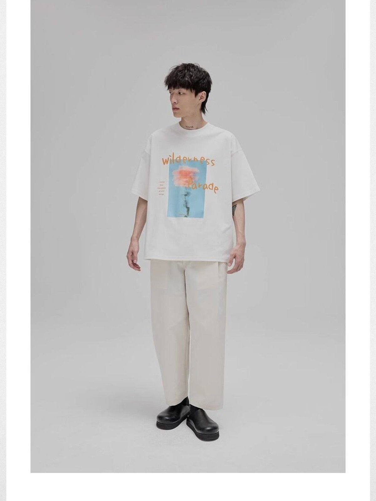 NANS Wilderness Parade Mercerized Tee in Orange - On Model