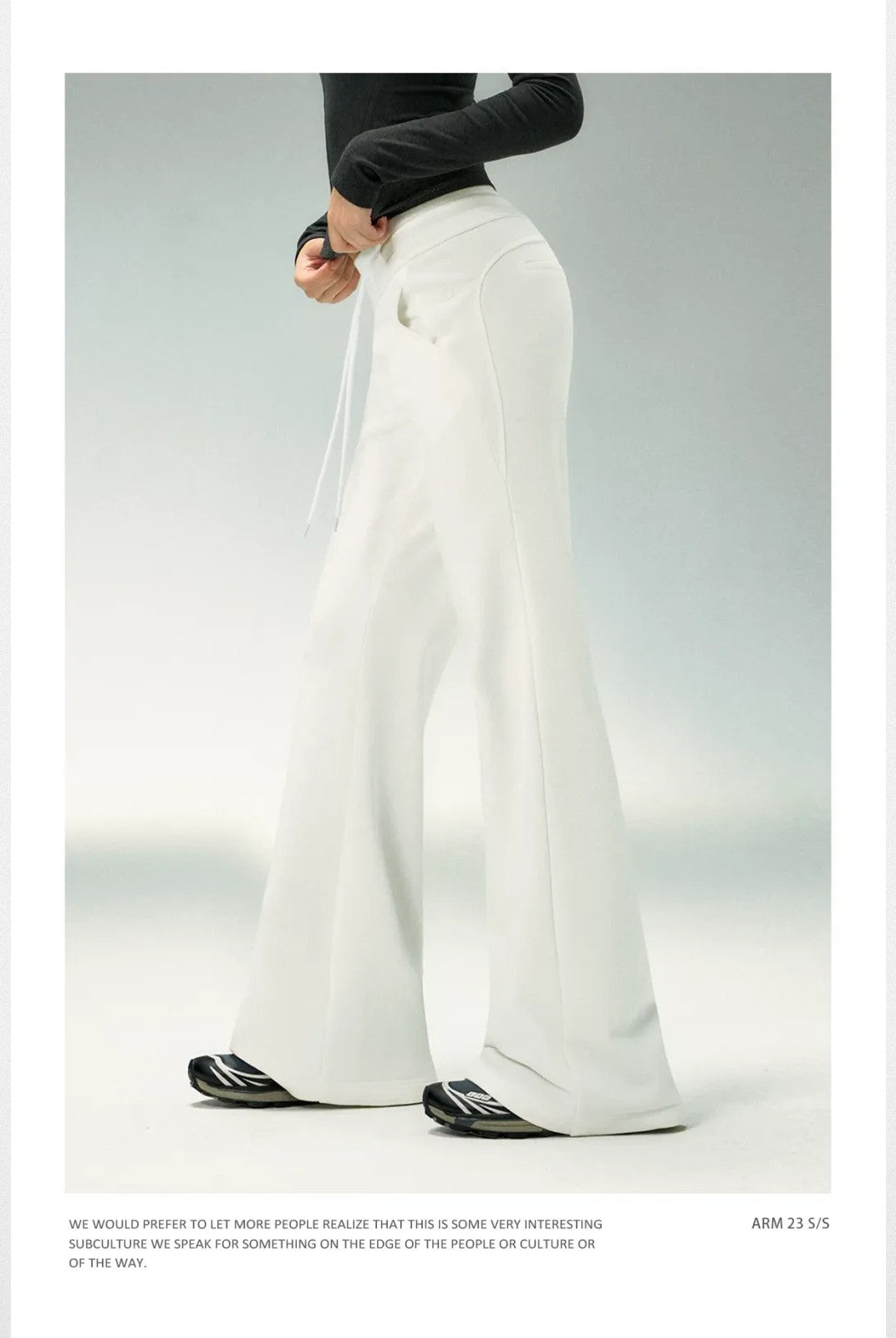 Ariseism Low Rise Micro Flare Sweatpants in White - On Model