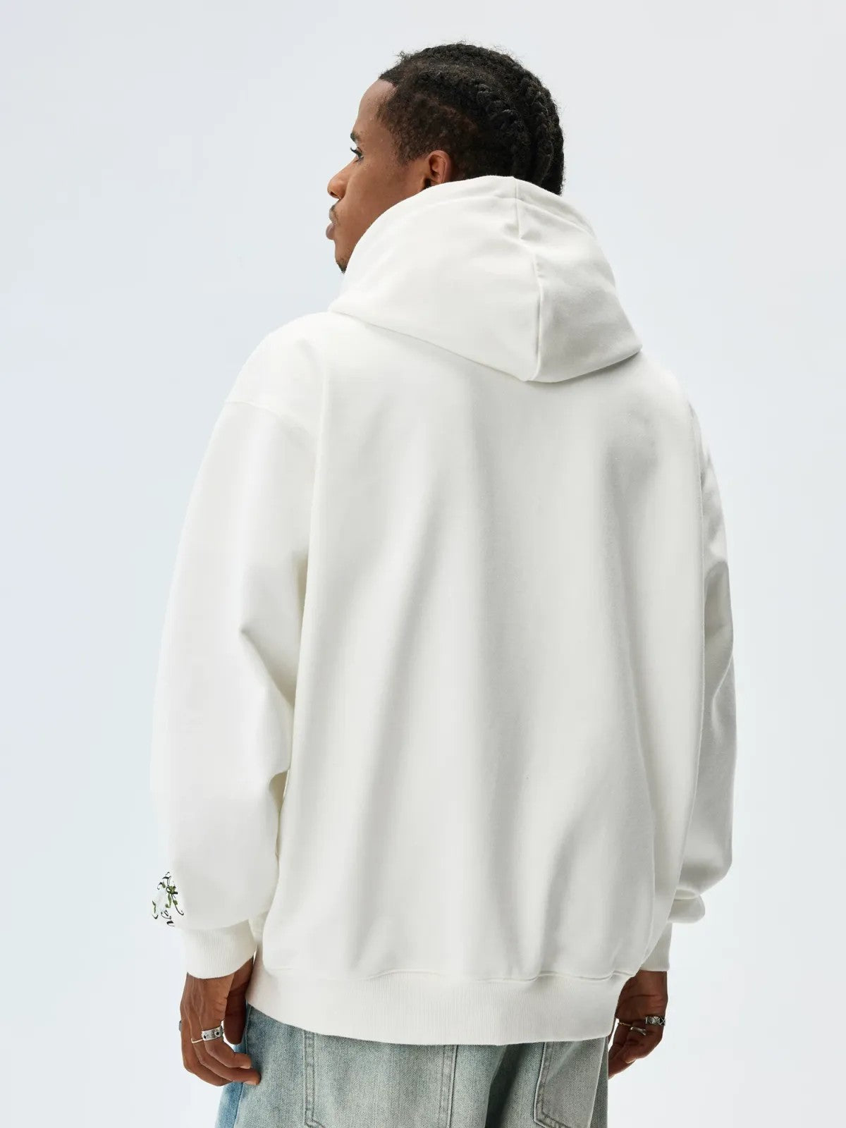 MEDM Camellia Embroidered Zip Hoodie in White - On Male Model