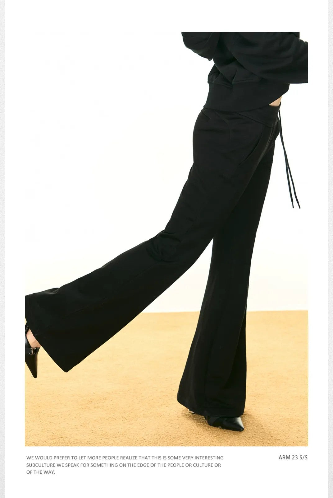 Ariseism Low Rise Micro Flare Sweatpants in Black - On Model