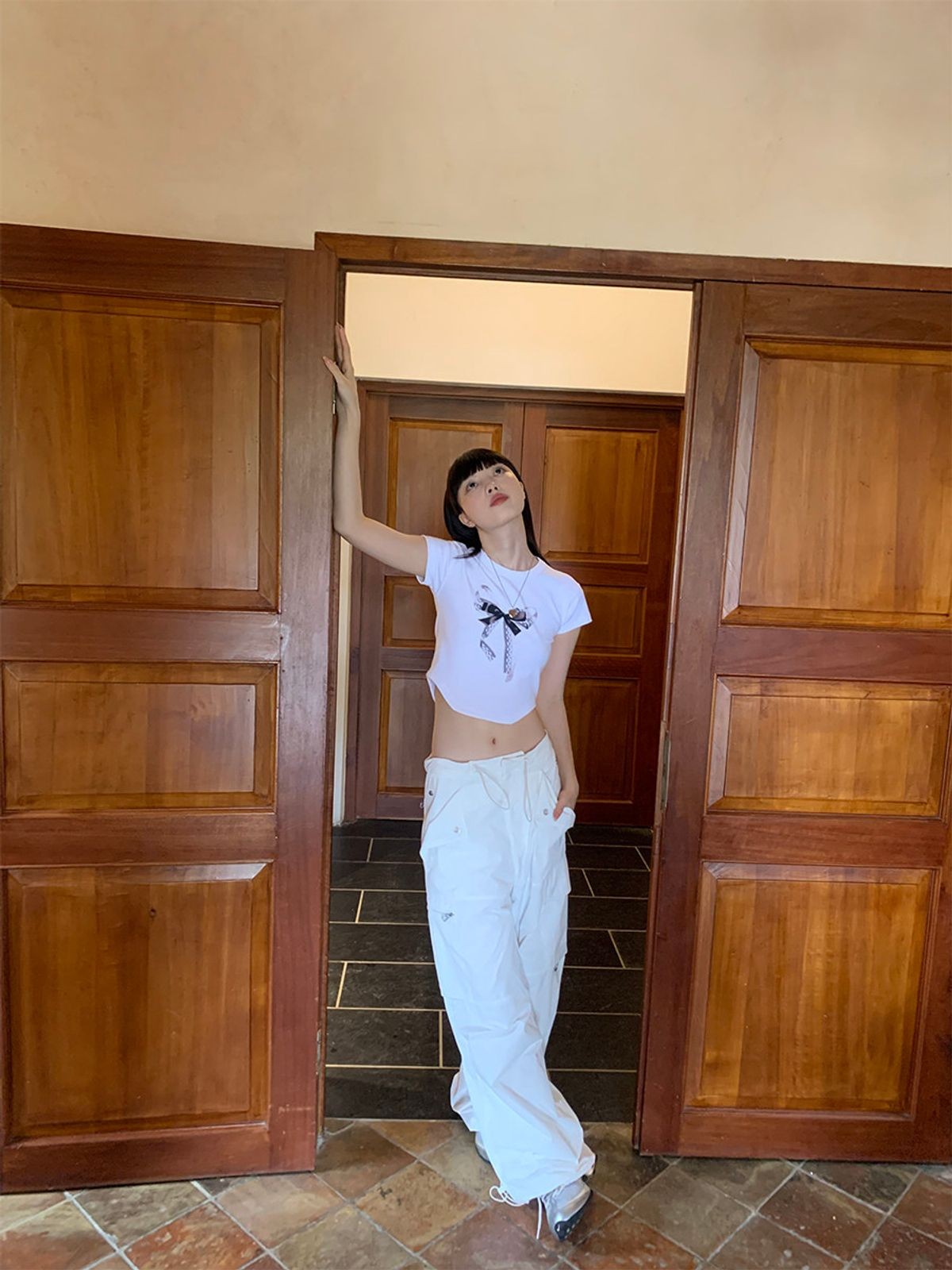 NeverSeez Lace Bow Graphic Baby Tee in White - On Model