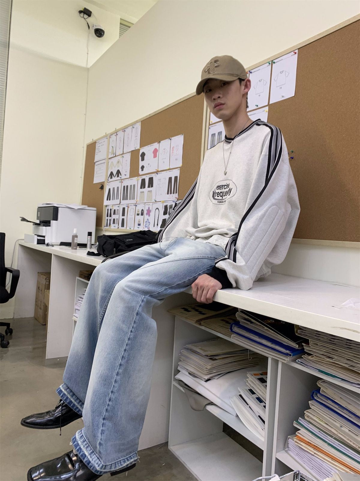 NeverSeez Distressed Washed Micro Flare Jeans in Blue - On Model