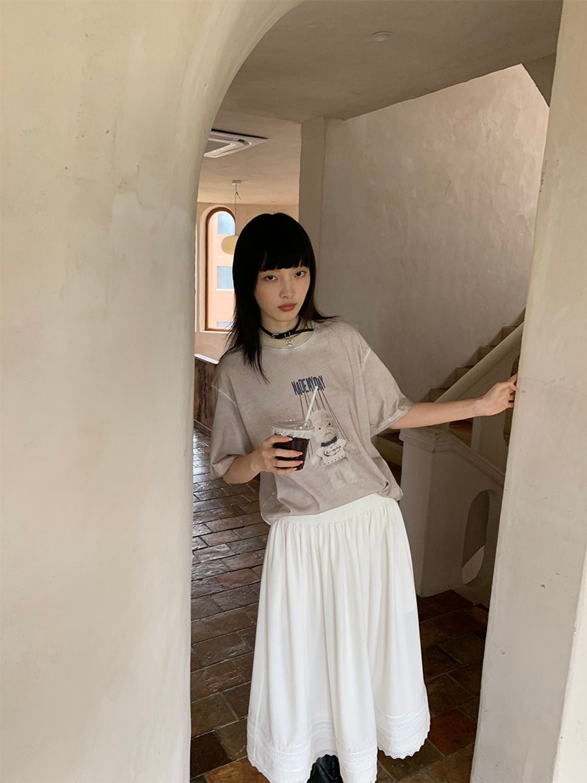 NeverSeez Garment Dyed Puppet Print Tee in Khaki - On Female Model