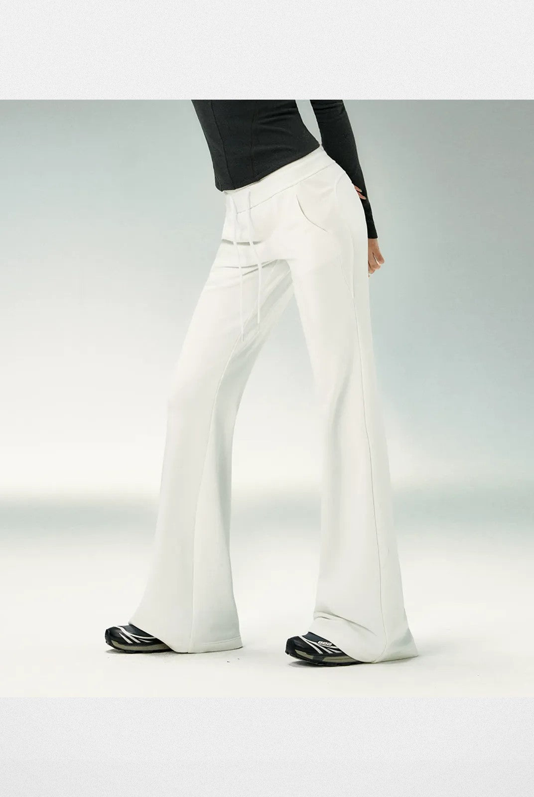 Ariseism Low Rise Micro Flare Sweatpants in White - On Model