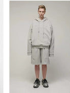 LOSTCTRL Embroidered Raw Edge Cotton Hoodie in Gray - On Model