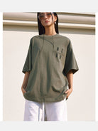MEDM Oversized Logo Print T Shirt in Olive - On Female Model