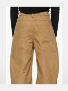 BLINDNOPLAN Irregular Pleated 3D Cut Cargo Pants in Beige - On Model