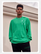 MEDM Embroidered Logo Long Sleeve Tee in Green - On Male Model