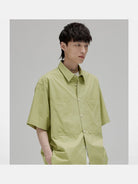 NANS Sand Washed Cotton Curved Hem Shirt in Green - On Model