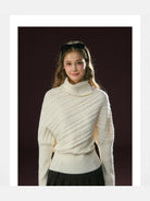 Ariseism Diagonal Cable High Neck Sweater in White - On Model