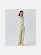 Simple Project Cuffed Corduroy Boot Cut Trousers in White - On Model