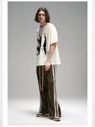 LOSTCTRL Mohe Ballroom Washed Graphic Tee in White - On Male Model