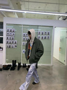 NeverSeez 3M Thinsulate Padded Bomber Jacket in Green - On Male Model