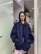 NeverSeez Vintage Wash Nylon Barn Jacket in Navy - On Female Model