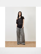 RandomPiece Asymmetric Linen Blend Knit Top in Black - On Model