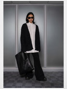 RARELY ALIKE Flared Cotton Denim Jeans in Black - On Model