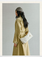 Songmont Vegetable Tanned Lambskin Pillow Hobo in Cream - On Female Model