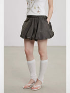 THELIGHT OFFICIAL Elastic Waist Bubble Mini Skirt in Olive - On Model