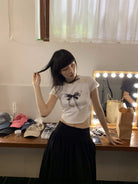 NeverSeez Lace Bow Graphic Baby Tee in White - On Model