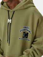 MEDM M Buckle Graphic Hoodie in Olive - On Male Model