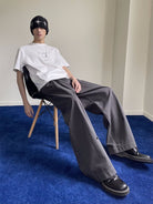 NeverSeez Embossed Script Cotton T Shirt in White - On Male Model