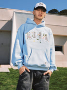 MEDM Floral Patch Fleece Hoodie in Sky Blue - On Male Model