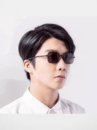 FUTURE UPDATE Hammered Titanium Sunglasses in Black - On Male Model