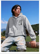 MEDM Camellia Embroidered Zip Hoodie in Gray - On Male Model