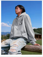 MEDM Camellia Embroidered Zip Hoodie in Gray - On Male Model