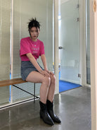 NeverSeez Embossed Script Cotton T Shirt in Hot Pink - On Female Model