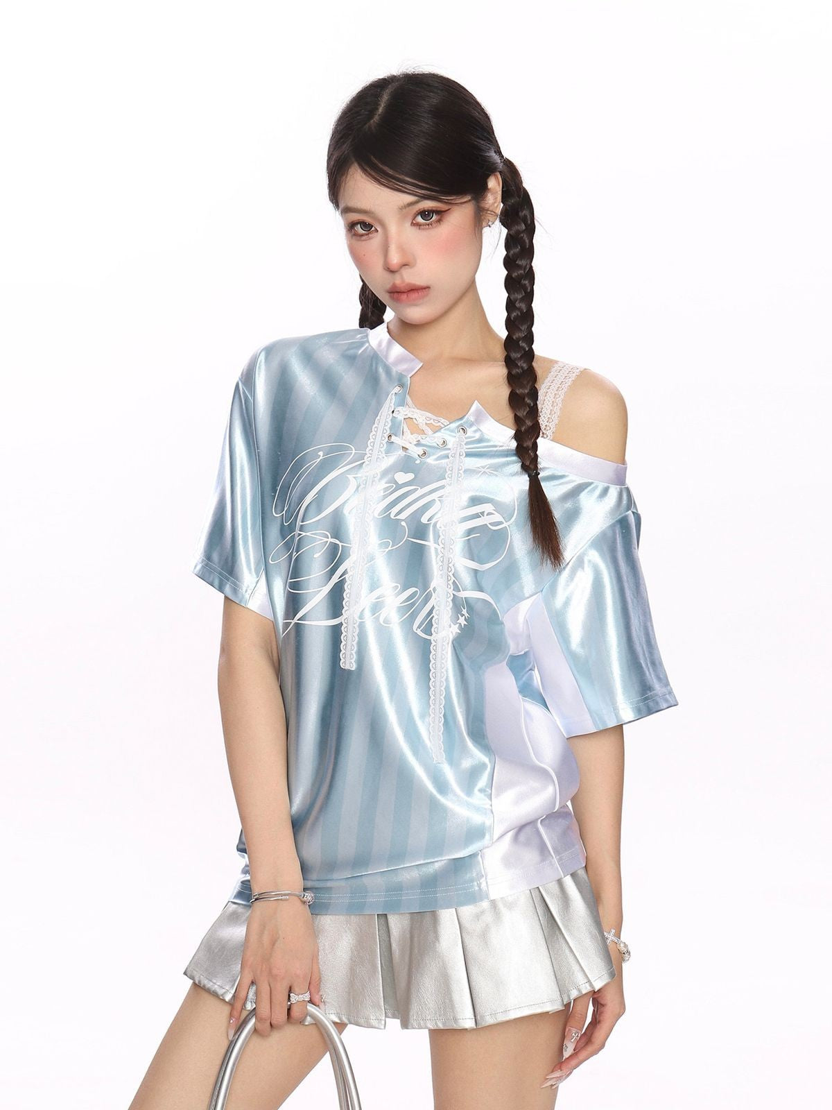 BIGGOLD STUDIO Asymmetric Lace Up Jersey Top in Blue - On Model #color_blue