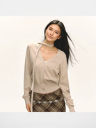 ARISEISM Cropped V Neck Cardigan Neck Tie in Beige - On Model