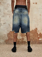 TRIANGLE PROJECT Deconstructed Distressed Denim Shorts in Blue - On Model