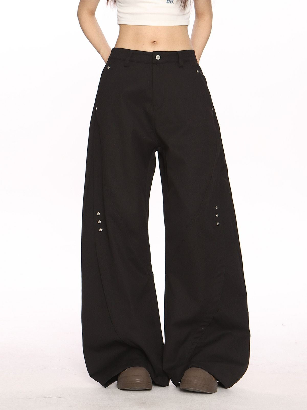 BIGGOLD STUDIO Deconstructed Curved Seam Trousers in Black - On Model #color_black