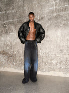 TRIANGLE PROJECT Dirty Wash Spray Detail Jeans in Black - On Model