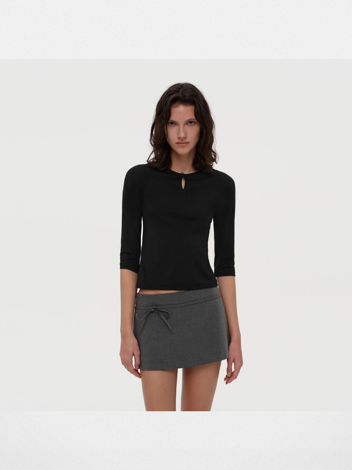 PUKI Lenzing Modal Bow Cutout 3 4 Sleeve Top in Black - On Model