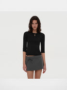 PUKI Lenzing Modal Bow Cutout 3 4 Sleeve Top in Black - On Model