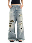 BLINDNOPLAN Distressed Camo Patch Jeans in Blue - On Model