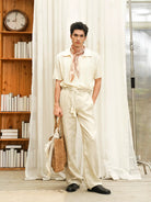 Retro 21 Handmade Raffia Cutout Tote Bag in Khaki - On Male Model