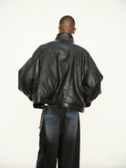 Triangle Project Boxy Faux Leather Padded Jacket in Black - On Model