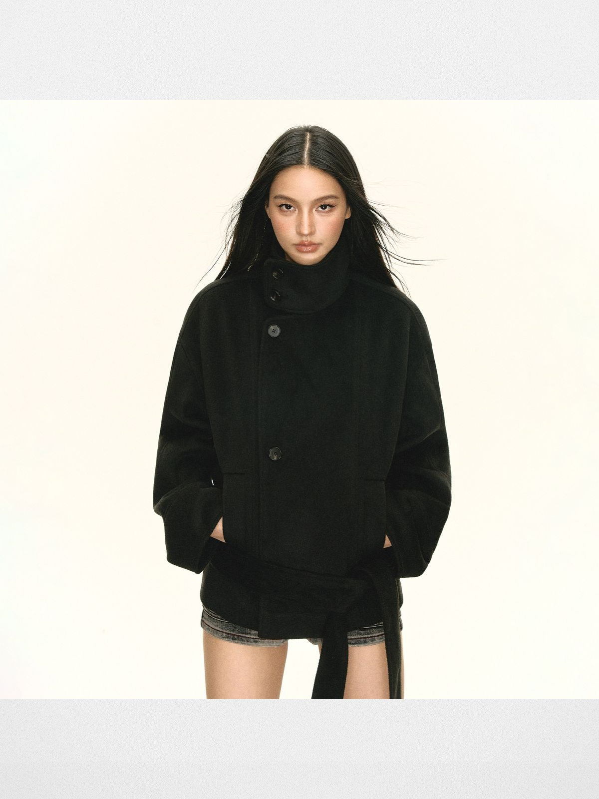 ARISEISM Short Belted Funnel Neck Coat in Black - On Model