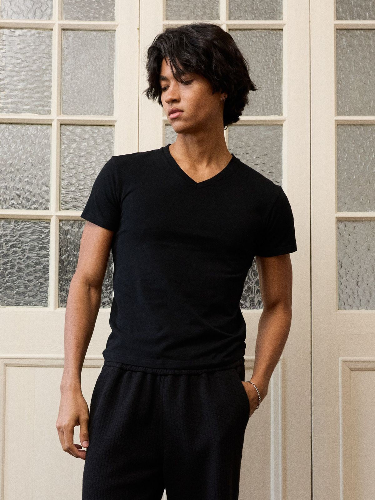 Retro 21 Anti Wrinkle V Neck T Shirt in Black - On Model