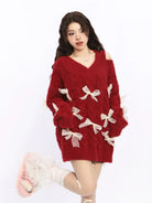 BIGGOLD STUDIO Bow Embellished Cold Shoulder Sweater in Red - On Model #color_red